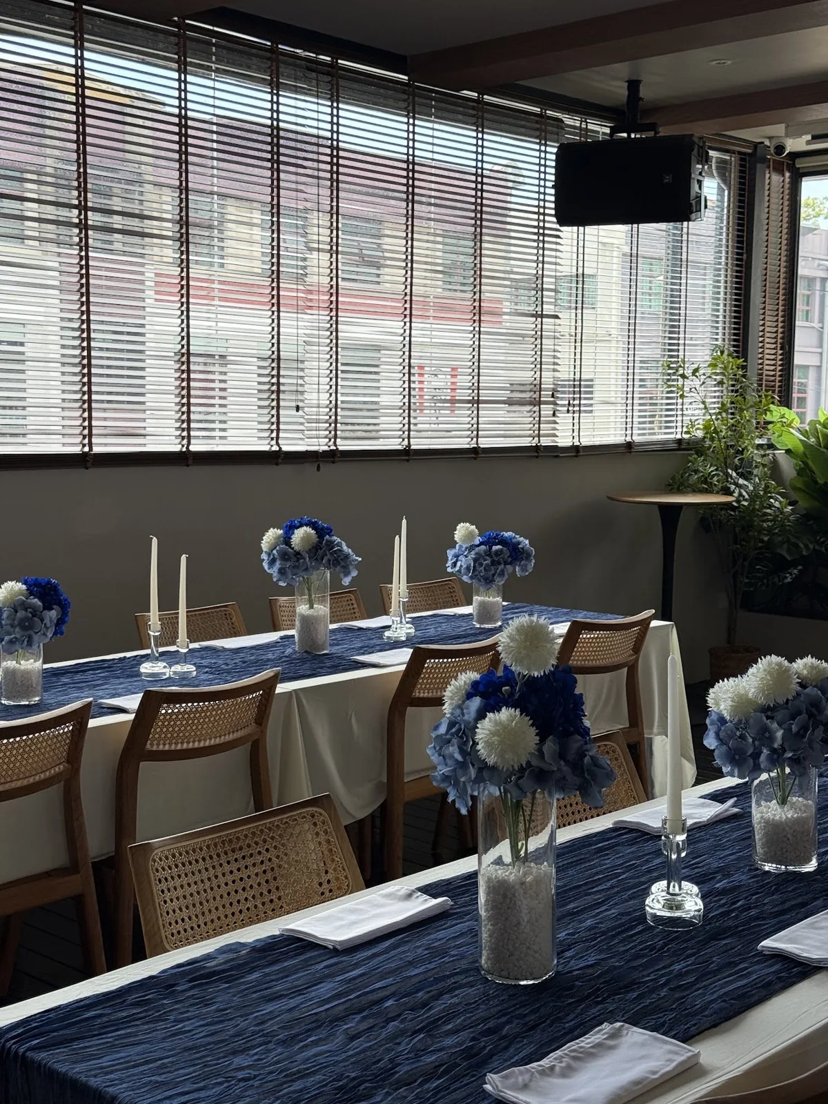 Candlelit tables set for a launch dinner